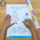 This sticker activity sheet for fine motor skill development is super cute, hand-drawn and you can download and print it for FREE!
